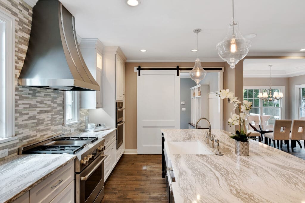 Large vent hood and island in kitchen kitchen remodel